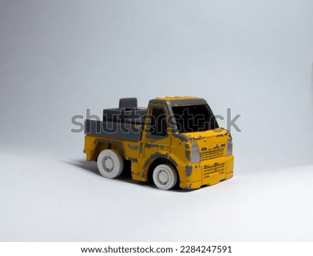 yellow car toy on white background