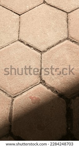 Paved floor background in the photo during the day with shadows