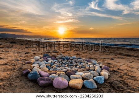 Sacred Ritual Stones For Spiritual Ceremony Are Are Arranged In A Circle During Sunset On The Beach