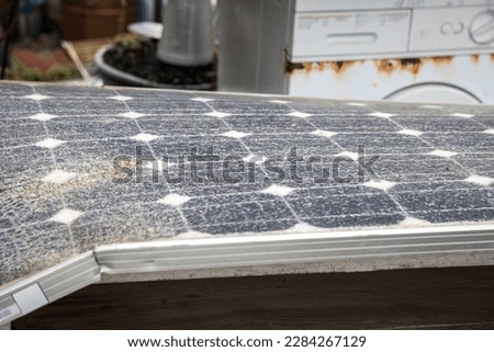 Solar panel in great state of degradation. Unused and discarded objects, old scrap. Royalty-Free Stock Photo #2284267129