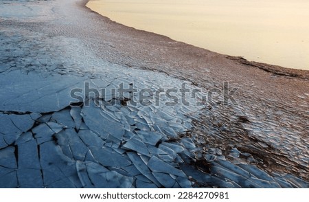 Aerial view of the winter icy coast of the North Sea Royalty-Free Stock Photo #2284270981
