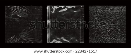 Polyethylene packaging for cd cover, vinyl. Photo with sealed effect. Polyethylene overlay texture set. Wrinkled, torn and old packaging. Square overlays for cd, vinyl design. Photo set	 Royalty-Free Stock Photo #2284271517