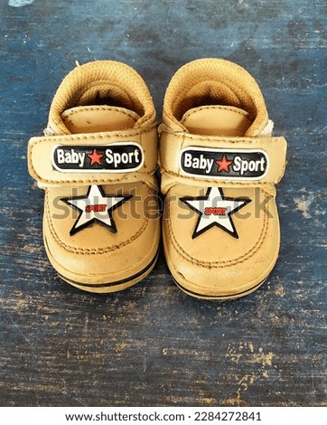 This is a pair of very cute, tiny and adorable baby shoes