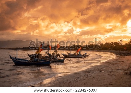 Fishing Boats at the Fishing Village Pak Nam Pran and Beach near the Town of Pranburi and the City of Hua Hin in the Province of Prachuap Khiri Khan in Thailand,  Thailand, Hua Hin, December, 2022 Royalty-Free Stock Photo #2284276097
