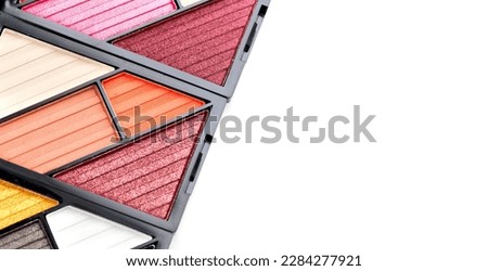 Make up palette set isolated on white background. Professional multicolor eyeshadow palette. Makeup. Professional multicolor eye shadow make-up palette, close-up. Various Colorful bright eye shadows. 