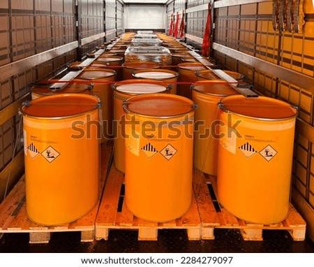Loading, transportation and unloading of barrels with hazard class 9 in a semi-trailer. Transportation of dangerous goods by ADR cargo transport Royalty-Free Stock Photo #2284279097