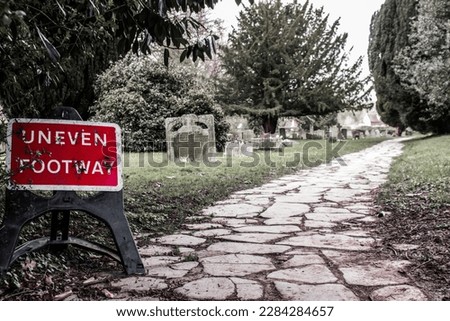 Uneven footway sign board and most amazing scene of footway