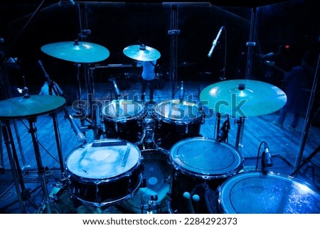 drum set on stage in a concert hall. Large-sized photo with soft change selectivity. Vintage live music background