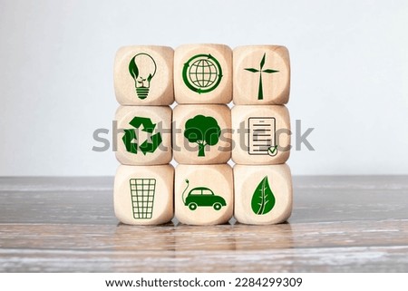 Green and eco building concept. wooden cubes with green building symbols on the natural background. LEED certification. Leadership in Energy and Environmental Design. Sustainable building. Royalty-Free Stock Photo #2284299309