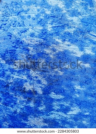 Wallpaper, background. Exotic texture, formed by the surface of an aged plastic piece of decorated blue color, similar to a jeans