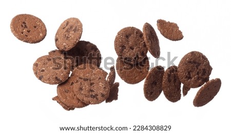 Cookie Chocolate ship round fall fly in mid air, Cocoa Cookie Chocolate ship floating. Cookie Chocolate ship complete round throw in air. White background isolated freeze motion high speed shutter