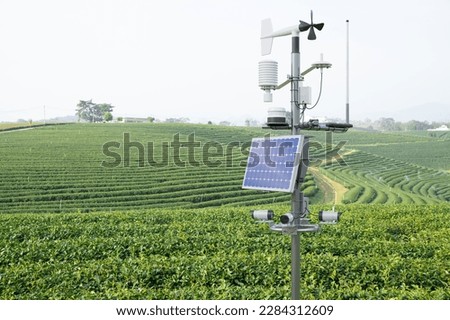 Weather station in green tea field, 5G technology with smart farming concept Royalty-Free Stock Photo #2284312609