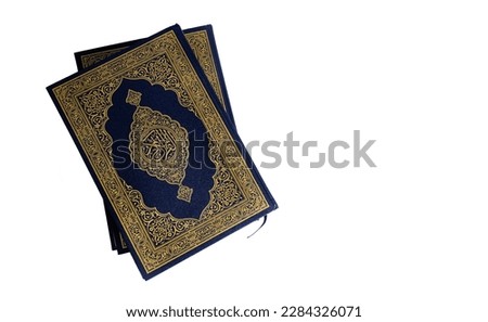 Quran book isolated on white background - close up Holly Qur'an or Koran, the calligraphy in the middle means the Book of the Koran.