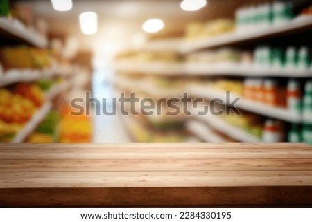 Tabletop view on modern product display in grocery or department store with wooden table and blurred backdrop for advertising and promotion on table showcase. Flawless Royalty-Free Stock Photo #2284330195