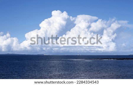 Cumulonimbus cloud over the sea Royalty-Free Stock Photo #2284334543