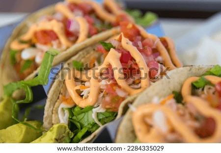 Close up of Taco Trio with Chipotle Sauce Royalty-Free Stock Photo #2284335029