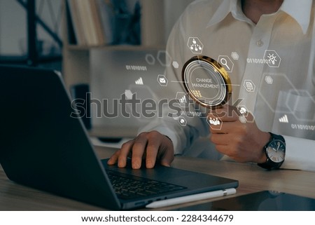 Businessman using a computer to document Change management in organization and business concept with consultant presenting icons of strategy. Organizational transition and transformation

