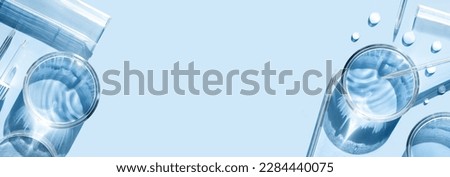 serum in petri dishes on light blue background cosmetic research concept Royalty-Free Stock Photo #2284440075