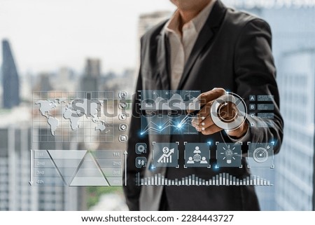 Businessman with a modern visual screen global network connection Graph analyzing financial growth and investment data planning