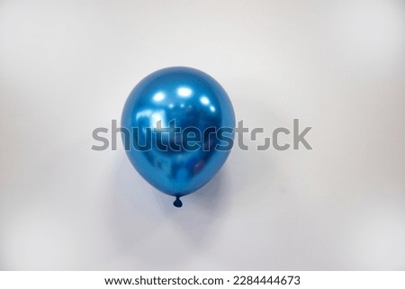 blue chrome shining balloon on the white background isolated