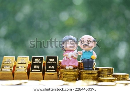 Mutual fund,Love couple senior with gold coin money and gold bar on natural green background, Save money for prepare in future and pension retirement concept Royalty-Free Stock Photo #2284450395