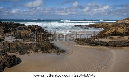 North Stradbroke Island Rock pools and beach views at Deadman's Beach with Surf and sand for a great holiday destination. April 2023.  Royalty-Free Stock Photo #2284460949
