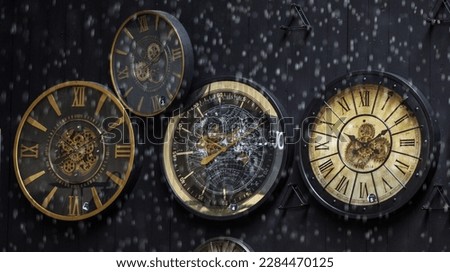 Clocks in the rain and snowfall