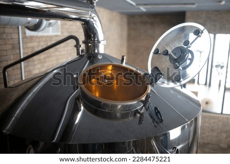 inside beer tunk, opened gate, brewery production Royalty-Free Stock Photo #2284475221