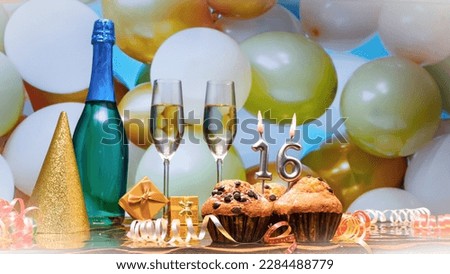 Happy birthday champagne background with number of candles  16. Beautiful congratulations copy space for anniversary.
Holiday decorations with balloons with a bottle of champagne in pastel colors.