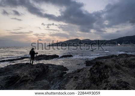 Artistic photos by the mediterranean sea. Person observing the greatness of the sea, contemplating the views that nature has given us