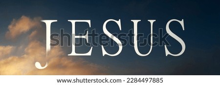 Abstract religious concept. Name of Jesus written on the evening sky with clouds and sunlight. Royalty-Free Stock Photo #2284497885