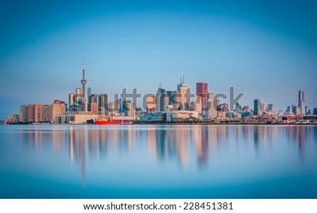 Skyline of Toronto over Ontario Lake at sunrise