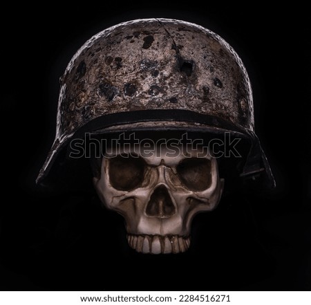 Military helmet with a human skull