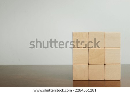 Object,Mock up item,business concept.,Blank Nine Wooden cubes for put text,logo and infographic stacked in square shaped on right side photo over white background with copyspace.