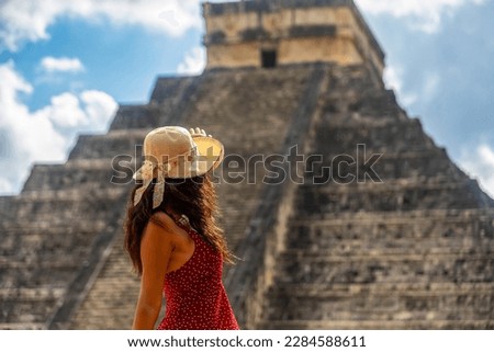 Tourist observing the old pyramid and temple of the castle of the Mayan architecture known as Chichen Itza, it is a ruins belonging to this ancient pre-columbian civilization and is part of humanity. Royalty-Free Stock Photo #2284588611