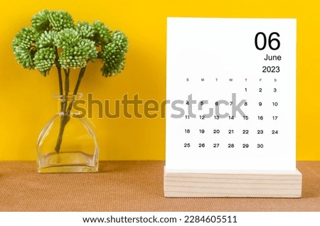 June 2023 Monthly desk calendar for 2023 year on yellow background. Royalty-Free Stock Photo #2284605511