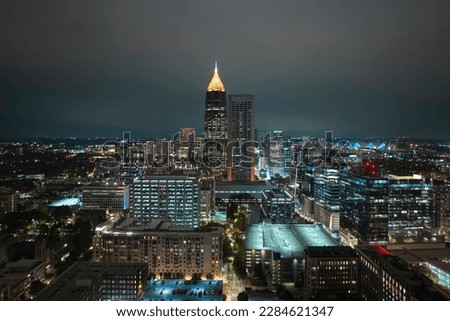 Night urban landscape of downtown district of Atlanta city in Georgia, USA. Skyline with brightly illuminated high skyscraper buildings in modern american megapolis
