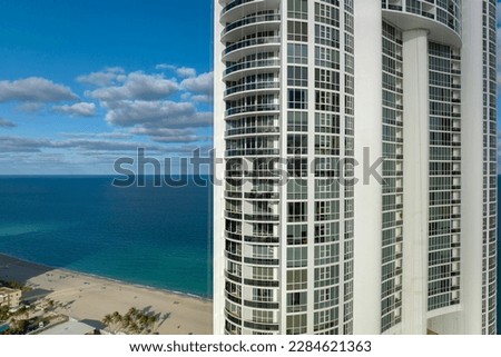 High angle view of Sunny Isles Beach city with expensive highrise hotels and condo buildings on Atlantic ocean shore. American tourism infrastructure in coastal southern Florida Royalty-Free Stock Photo #2284621363