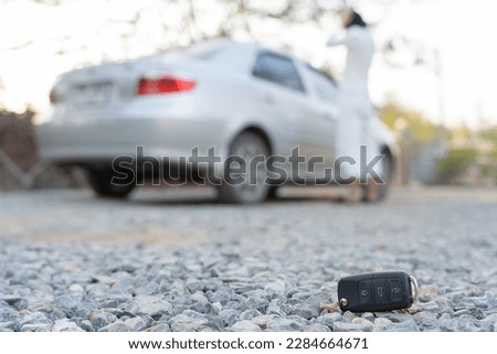Lost car keys on the ground, Car keys dropped on the floor or fall lying on the street home front . Walking Away From Lost Car Key, can not transport, express, rush time, wast time, emergency
