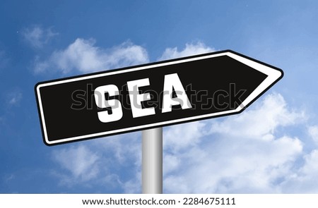 Sea road sign on sky background