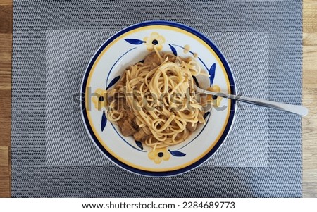 Spaghetti Mushrooms sauce creme on wood table
Smartphone picture, raw footage