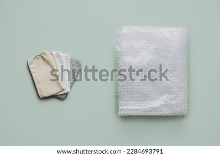 Recycling Fibers in the Textile Industry. Sustainable recycled cotton fiber. Many napkins fabrics made of recycled polyester synthetic fabric and bubble wrap Royalty-Free Stock Photo #2284693791