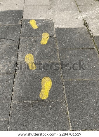 Foodsteps on a pavement in Germany
