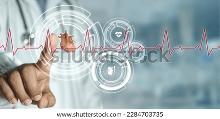 Doctor touching scan to check patient's heart through to icons network connection with modern interface on digital monitor in hospital background. Medical technology network concept.