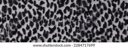 Top view of leopard wrinkled smooth black cloth seamless pattern background. Dark transparent fabric mesh with animal print background