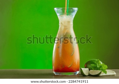 summer refreshing drink with orange lime and ice in a decanter Royalty-Free Stock Photo #2284741911
