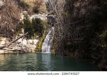 Clear Turquoise Water on a Cascade of Waterfalls and the Adonis Natural Bath, Surrounded by White Rocks and Green Thickets in the Troodos Mountains (Koili, Paphos District, Cyprus) Royalty-Free Stock Photo #2284745027