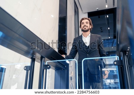 Businessman technology use key card scan gate entrance station to identification security routine office building.  Royalty-Free Stock Photo #2284756603