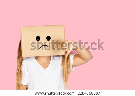 Woman with her head in a box, sad gesture and thumb down standing on a white background with copy space
