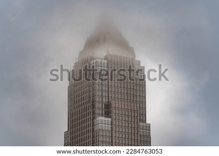 Cleveland Ohio Urban City Key Tower Skyline Tall Building With Clouds and Fog Dark Sky On A Cold, Foggy and Gloomy Day